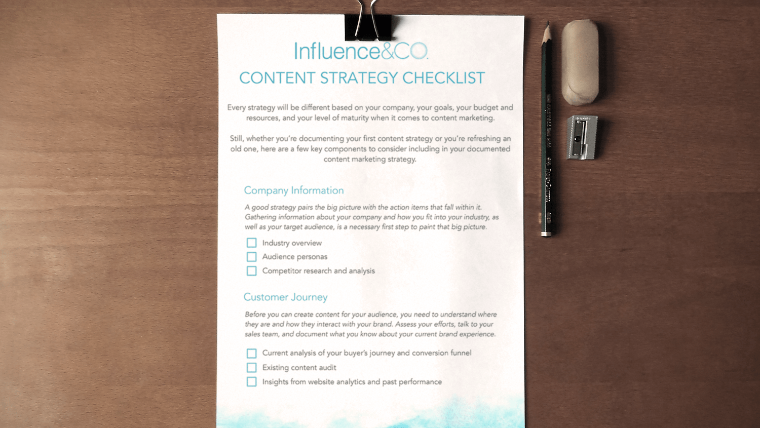 Interactive Content Strategy Checklist. Image contents: Photo of the top view of the content strategy checklist, a pencil, a pencil sharpener, and an eraser.